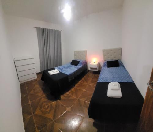 En eller flere senge i et værelse på Cordon del Velazco