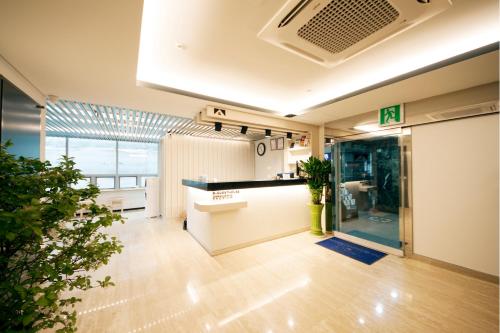 an office with a kitchen and a living room at K-Guesthouse Dongdaemun Premium in Seoul