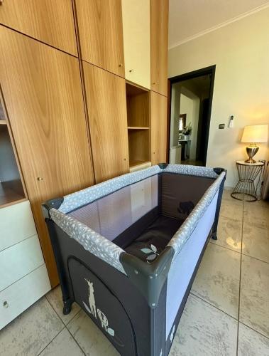 an empty bed in a room with a cabinet at Eleni's Luxury Stay - Kos in Zipárion