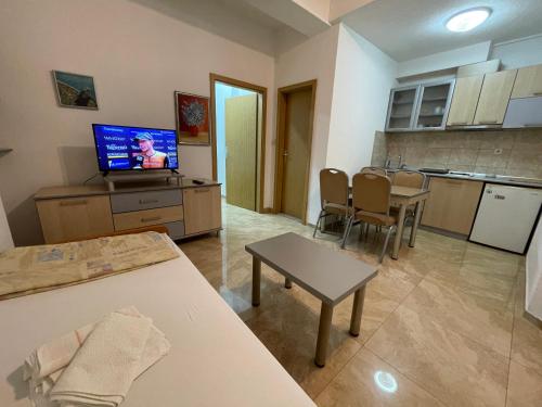 a living room with a kitchen and a dining room at Kukunesh Apartments in Ohrid