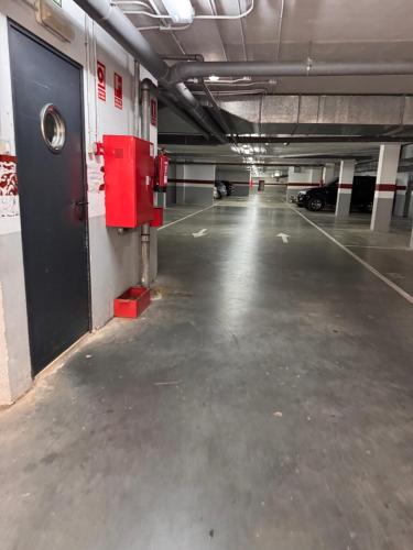 an empty parking garage with cars parked in it at apartamento luanco playa in Luanco