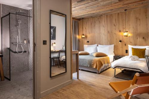 Ένα ή περισσότερα κρεβάτια σε δωμάτιο στο Hotel MONT-BLANC VAL D'ISERE