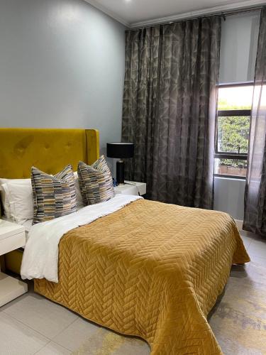 Кровать или кровати в номере 387 Ligusha Lane, Tubungu Estate