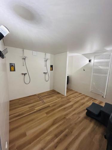 a room with two shower systems on the wall at GÎTE Au 21 Loveroom in Beaumont-la-Ronce