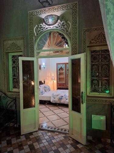 an open doorway to a bedroom with a bed at Eden Suites 