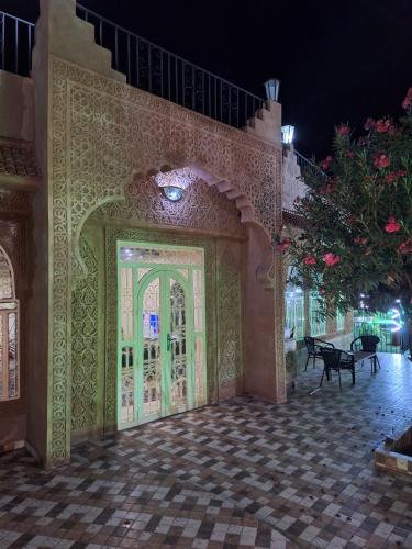 an entrance to a building with a large door at Eden Suites 
