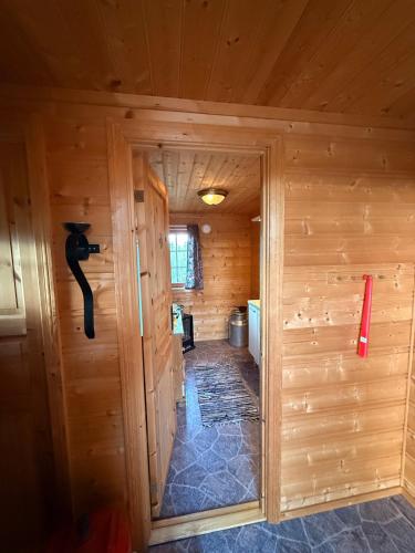 an inside view of a log cabin with a door at Spacious mountain cabin in Valdres with 3 bedrooms in Vevle