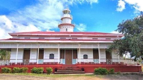 a lighthouse on top of a building at Sea-Sky Blue Beach Resort at Malabrigo Lobo Batangas-TW in Lobo