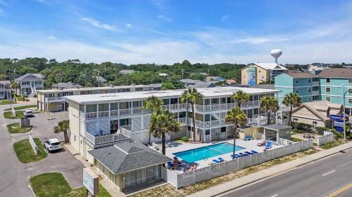 an aerial view of a building with a swimming pool at Ocean Blvd Paradise Steps to Beach w Pool and Grill in Myrtle Beach
