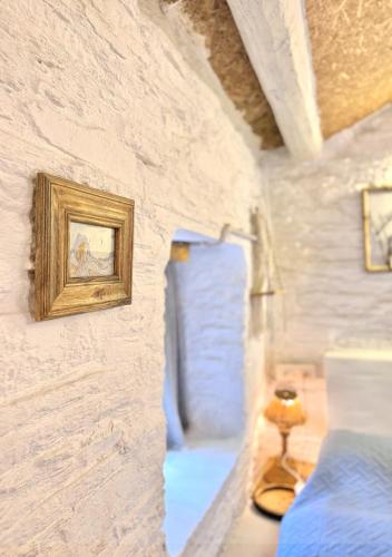a room with a wall with a picture on it at Aikkya Farms in Mukteswar