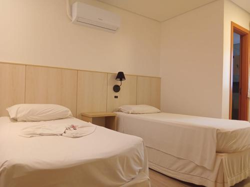 Postel nebo postele na pokoji v ubytování Hotel Turella