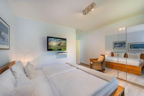 En eller flere senge i et værelse på Haus Sandkorn