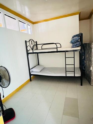 a bedroom with a bunk bed in a room at Becca's Vacation House 