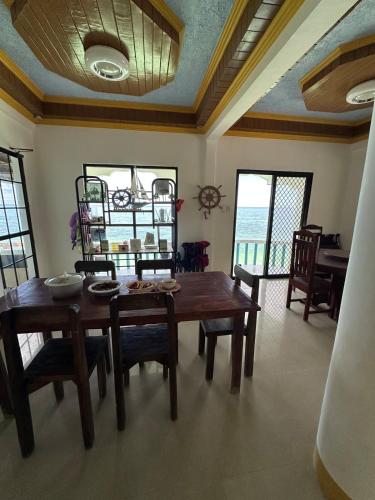 a dining room with a wooden table and chairs at Becca's Vacation House 