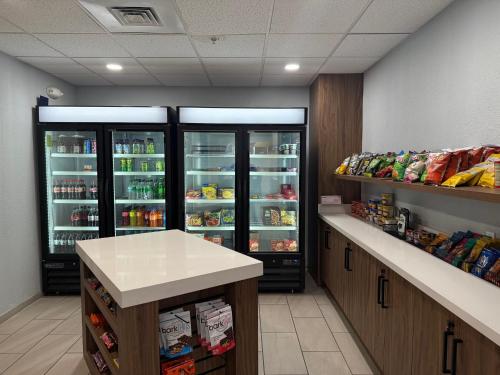 a room with two large refrigerators in a store at Holiday Inn Express Hotel & Suites Loveland by IHG in Loveland