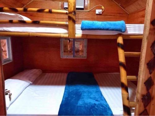 two bunk beds on a boat with acknowledccess at Sea-Sky Sky Blue Beach Resort at Malabrigo Lobo Batangas in Lobo