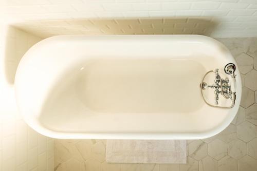 a white sink in a bathroom at Oakridge House. Spacious and historic home in downtown Ironton, Ohio. in Ironton