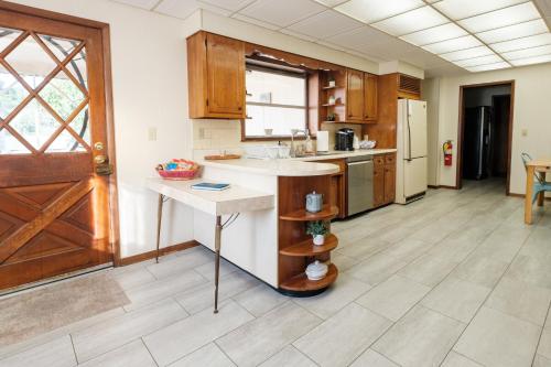 a kitchen with a sink and a counter in a room at Oakridge House. Spacious and historic home in downtown Ironton, Ohio. in Ironton