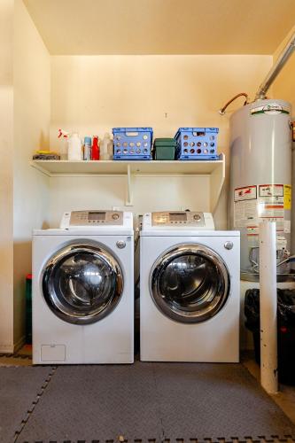 two washing machines and a washer and dryer in a room at Amazing Gilbert home 3 Bed 2 and half Bath sleeps 8 2 car garage in Gilbert