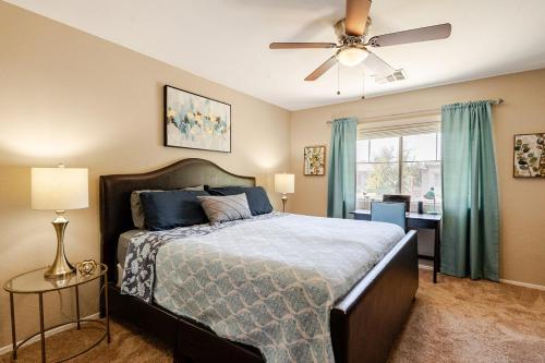 a bedroom with a bed and a ceiling fan at Amazing Gilbert home 3 Bed 2 and half Bath sleeps 8 2 car garage in Gilbert