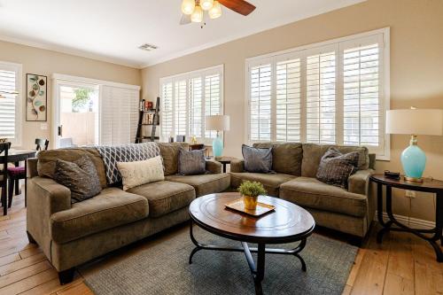 a living room with a couch and a table at Amazing Gilbert home 3 Bed 2 and half Bath sleeps 8 2 car garage in Gilbert