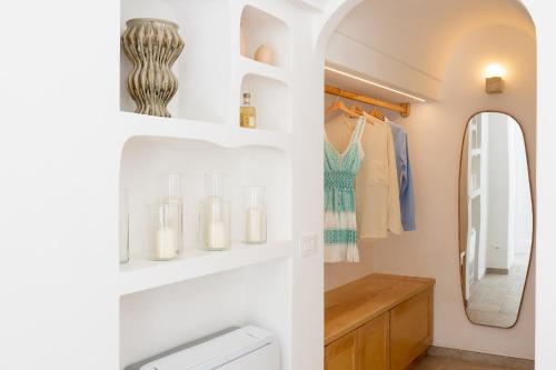 a bathroom with a sink and a mirror at Casanova Suite in Positano