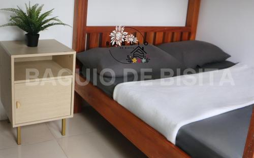 Uma cama ou camas num quarto em Baguio De Bisita