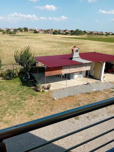 a red roofed building with a red roof at Rent apartment for a short time in Alexandroupoli