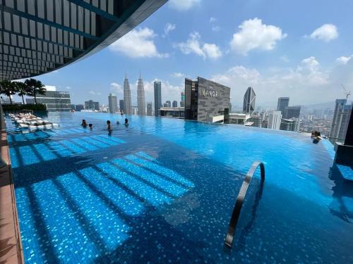 a large swimming pool on the roof of a building at Eaton Residences KLCC in Kuala Lumpur