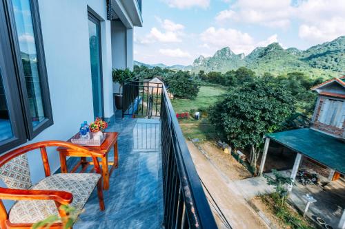 a balcony with a view of the mountains at Green Riverside Cosy Home in Bố Trạch