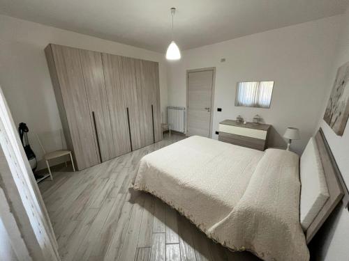 Ένα ή περισσότερα κρεβάτια σε δωμάτιο στο Casa Bruna