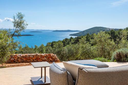 a patio with a view of the water at Villa Nai 3.3 in Žman