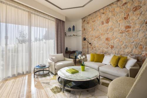 a living room with a couch and a table at Villa Nai 3.3 in Žman