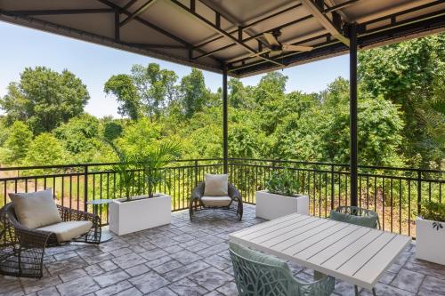 an outdoor patio with a table and chairs at EVEN Hotel Orlando International Airport by IHG in Orlando