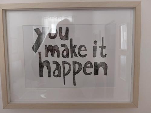 a framed picture of a sign that says you make it happen at A 50 passi dal lago - Affitti Brevi Italia in Capodimonte