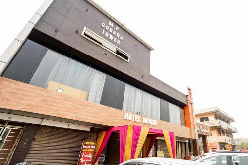 a store front of a building with arider mom at Hotel O Howdy in Ballabgarh