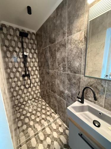 a bathroom with a shower and a sink at Wtite Sea 2 in Kavála