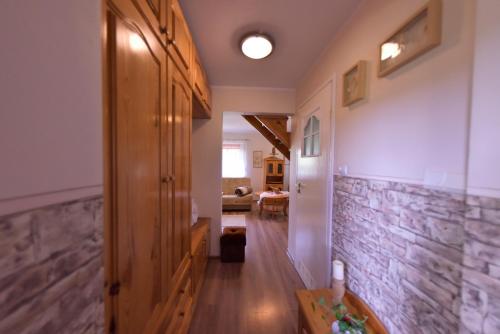 a hallway of a house with a stone wall at Drzemalik wypoczywaj z KLASĄ in Skarlin