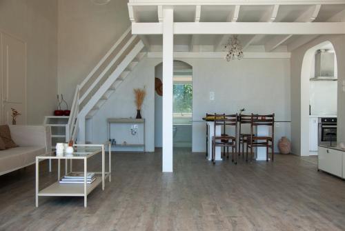 a living room with a couch and a table at The Countryhouse - Retreat with Pool & SeaView in Rethymno Town