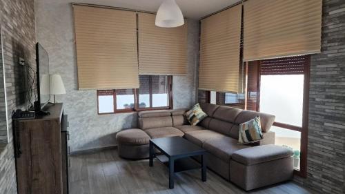 a living room with a couch and a table at Hôtel Mandy in Tetouan