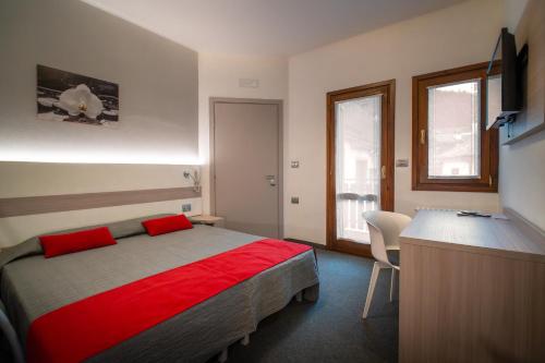 Postel nebo postele na pokoji v ubytování Hotel Del Negro