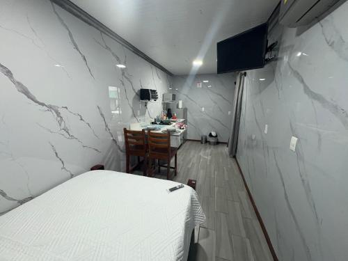 a room with a bed and a table in it at Apartamento doña Lety in Fortuna
