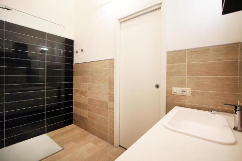 a bathroom with a sink and a shower at Villa Sa Marchesa in Solanas