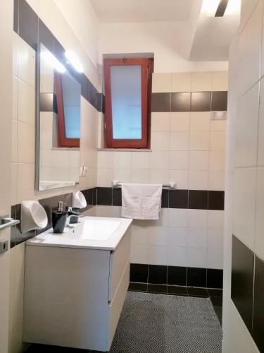 a bathroom with a sink and a mirror at Sulla spiaggia di Letojanni in Letojanni