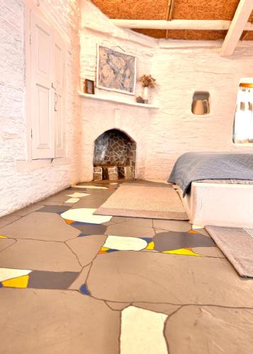 a room with a stone floor with drawings on it at Aikkya Farms in Mukteswar