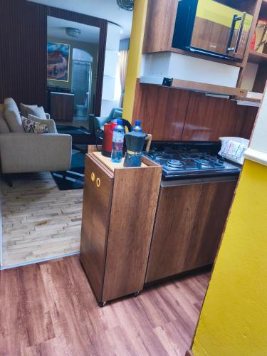 a kitchen with a stove top in a room at Classy Andino & primer piso, 2 dormitorios in Lima