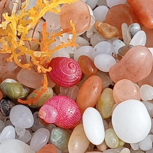 a pile of rocks and stones with a red egg at Villa Sa Marchesa in Solanas