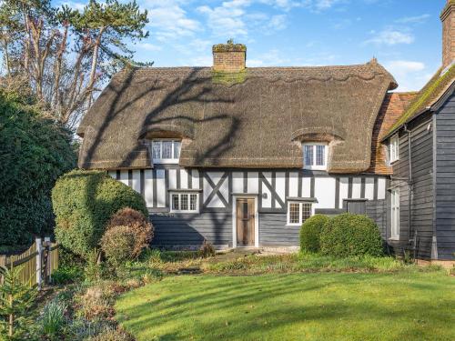 an old house with a thatched roof at Malting Cottage in Much Hadham