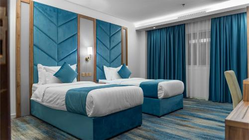 Postel nebo postele na pokoji v ubytování ALHYAT Hotel - فندق الحياة