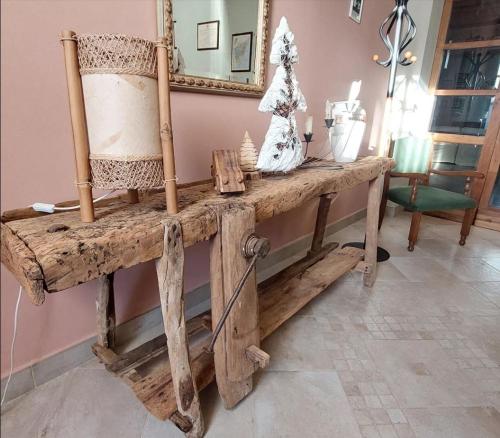 a room with a wooden table with a mirror at Podere Gian Battaglia in Fucecchio
